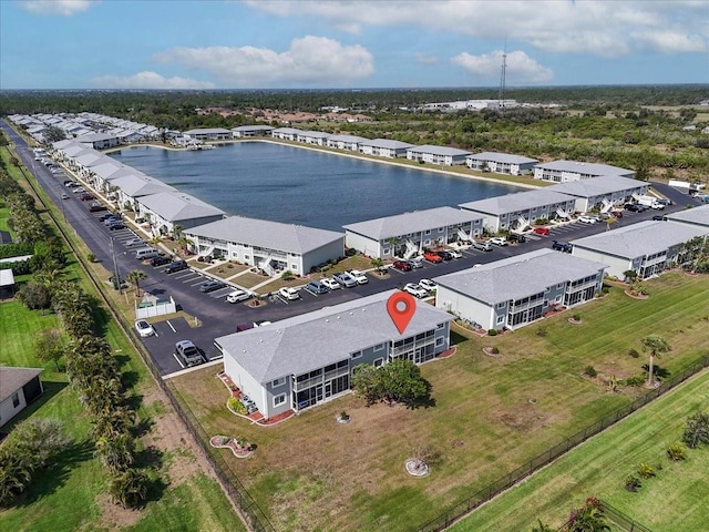 birds eye view of property with a water view