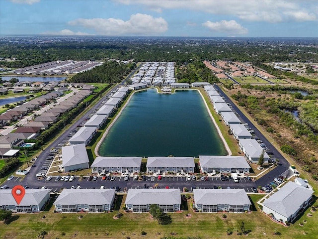 bird's eye view featuring a water view and a residential view