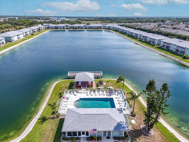 drone / aerial view with a water view and a residential view