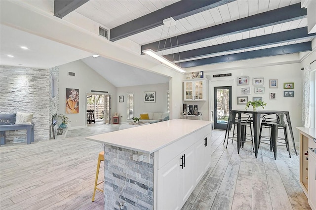 kitchen featuring light wood-style floors, plenty of natural light, and open floor plan