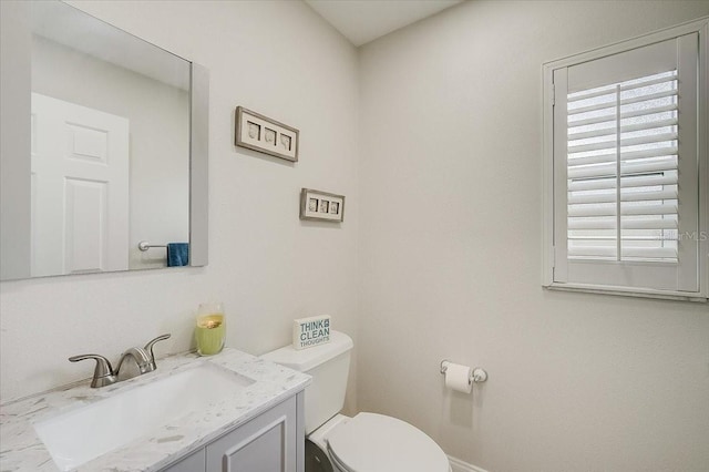 half bath with toilet and vanity