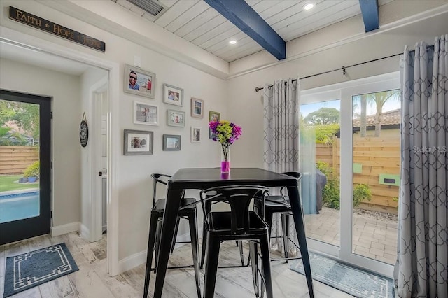 dining room featuring a wealth of natural light, baseboards, beamed ceiling, and recessed lighting