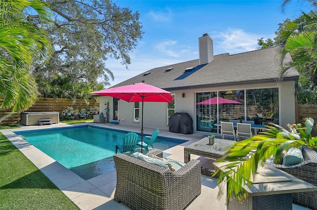 view of swimming pool featuring a fenced in pool, a hot tub, grilling area, a patio area, and fence