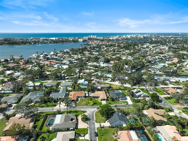 birds eye view of property featuring a water view