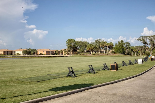 view of property's community featuring a yard