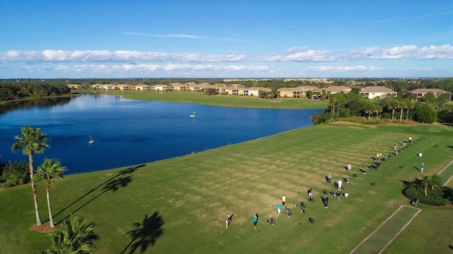 drone / aerial view with a water view and a residential view