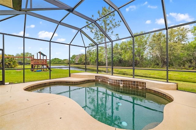 12211 Lavender Loop, Bradenton, FL 34212 - swimming pool featuring a yard, a patio, a playground, a lanai, and view of wooded area