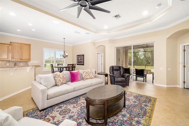 12211 Lavender Loop, Bradenton, FL 34212 - living area with arched walkways, light tile patterned floors, ornamental molding, a raised ceiling, and ceiling fan