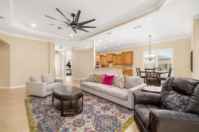 12211 Lavender Loop, Bradenton, FL 34212 - living area with a ceiling fan, ornamental molding, a tray ceiling, a chandelier, and light tile patterned floors