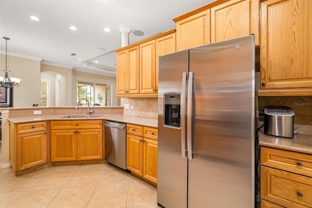 12211 Lavender Loop, Bradenton, FL 34212 - kitchen featuring stainless steel appliances, crown molding, a sink, tasteful backsplash, and a peninsula