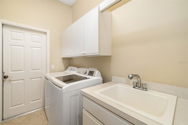 12211 Lavender Loop, Bradenton, FL 34212 - laundry area featuring cabinet space, washer and clothes dryer, and light tile patterned floors