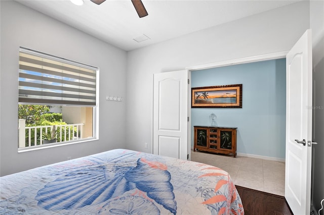 bedroom with ceiling fan and wood-type flooring