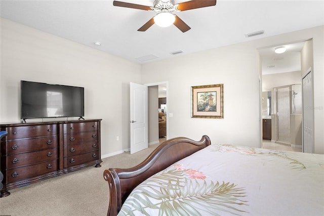 bedroom with light carpet, connected bathroom, and ceiling fan