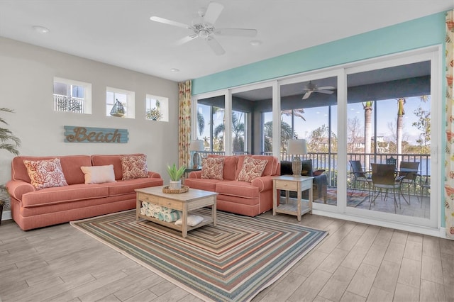 living room featuring ceiling fan and wood finished floors