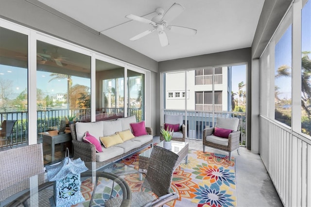 sunroom featuring ceiling fan