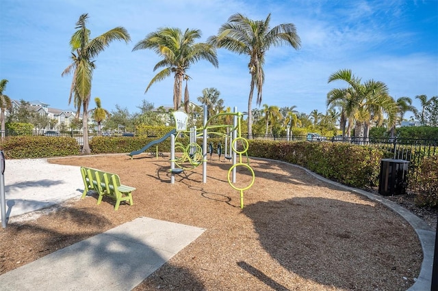 communal playground featuring fence