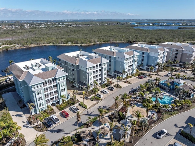 birds eye view of property with a water view