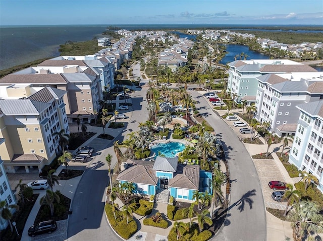 aerial view with a water view and a residential view