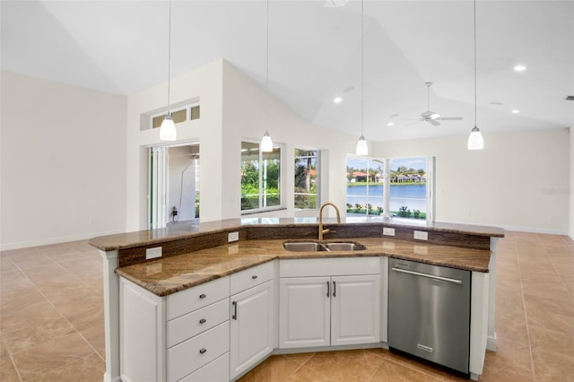 kitchen featuring a sink, open floor plan, stainless steel dishwasher, dark stone countertops, and decorative light fixtures