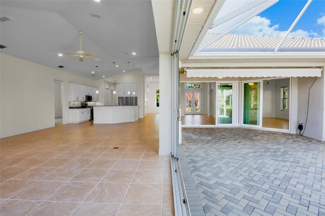 view of patio / terrace with glass enclosure and ceiling fan