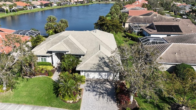 bird's eye view featuring a residential view and a water view