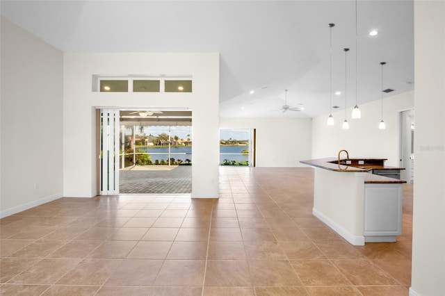 4941 Sabal Lake Cir, Sarasota, FL 34238 - kitchen featuring open floor plan, dark countertops, light tile patterned floors, pendant lighting, and recessed lighting