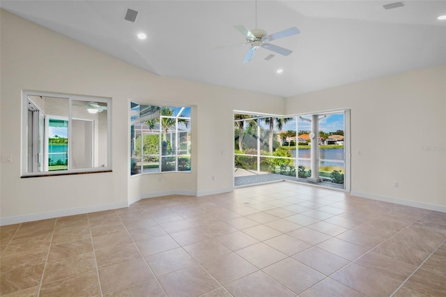 4941 Sabal Lake Cir, Sarasota, FL 34238 - empty room with a ceiling fan, lofted ceiling, a water view, light tile patterned flooring, and baseboards