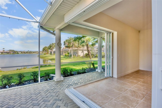4941 Sabal Lake Cir, Sarasota, FL 34238 - unfurnished sunroom with a water view and baseboards