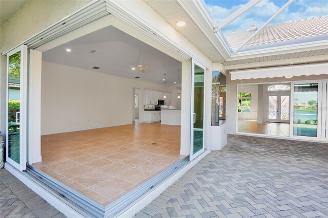 4941 Sabal Lake Cir, Sarasota, FL 34238 - unfurnished sunroom with french doors
