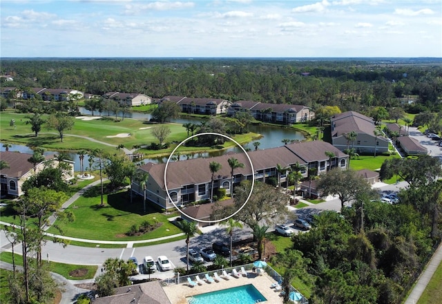 birds eye view of property with a residential view and a water view