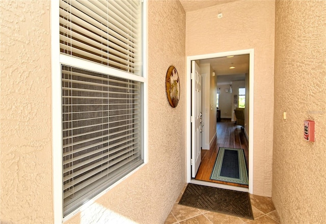 entrance to property with stucco siding