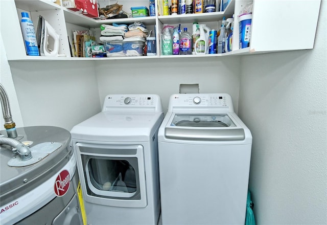 washroom featuring laundry area and separate washer and dryer
