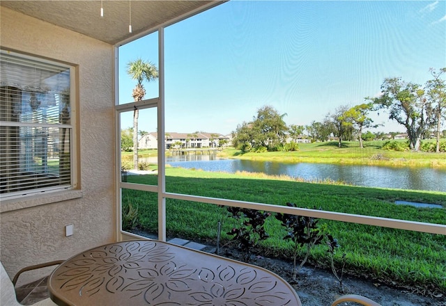 sunroom with a water view