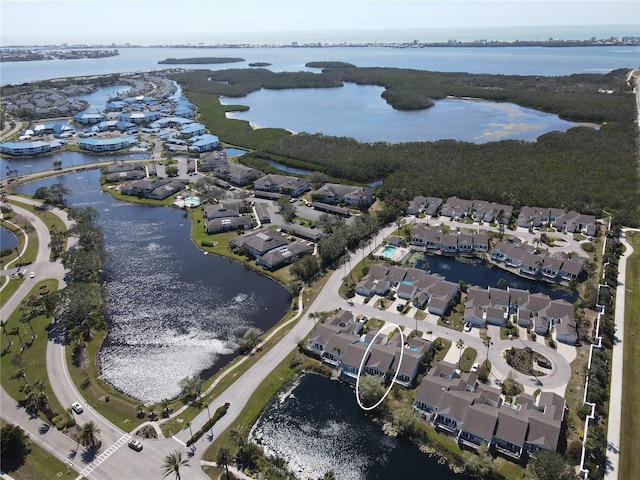 birds eye view of property featuring a residential view and a water view