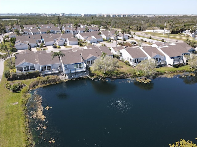 bird's eye view featuring a residential view and a water view