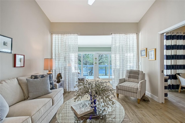 living area featuring wood finished floors and baseboards