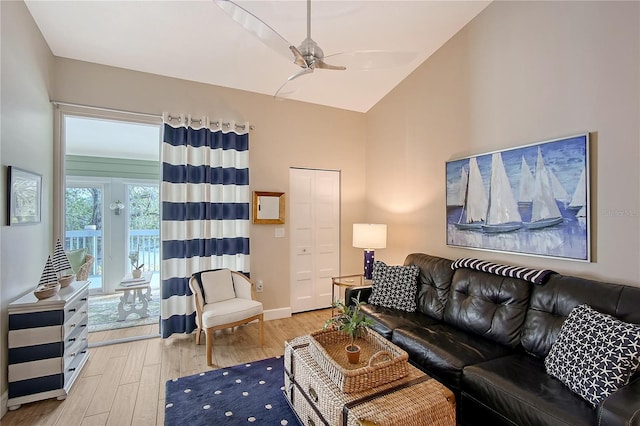 living room with high vaulted ceiling, baseboards, a ceiling fan, and wood finished floors