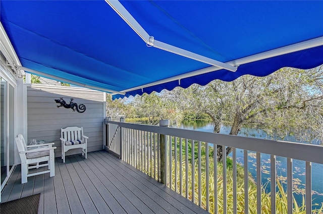 wooden deck with a water view