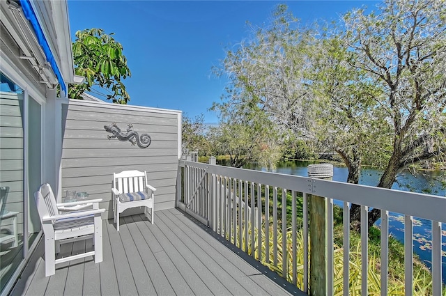 wooden deck with a water view