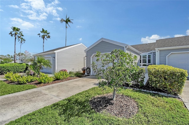 view of front facade featuring concrete driveway and an attached garage