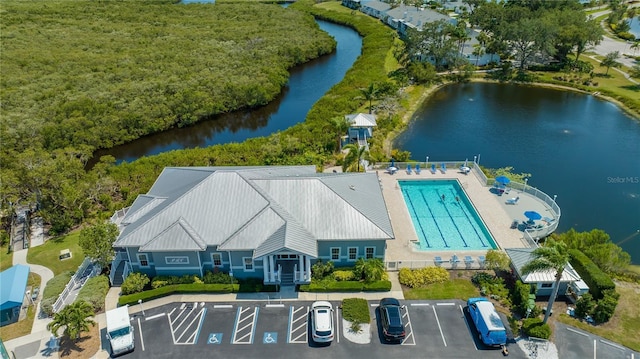 birds eye view of property featuring a water view