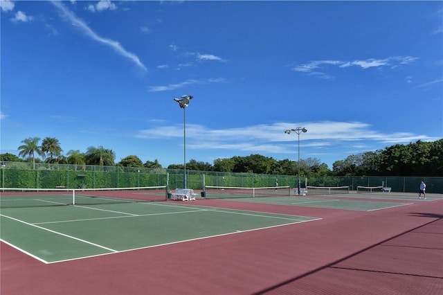 view of sport court featuring community basketball court and fence