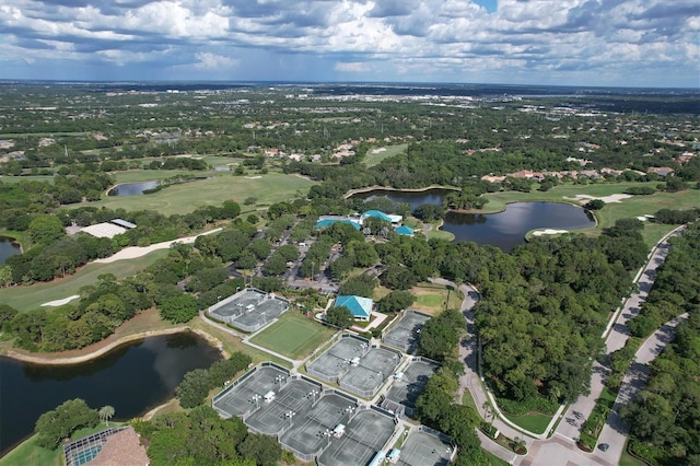 aerial view featuring golf course view and a water view