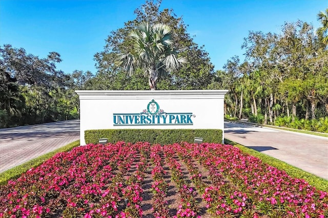 community / neighborhood sign with driveway