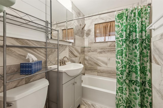 full bathroom featuring tile walls, toilet, shower / bath combo, and vanity