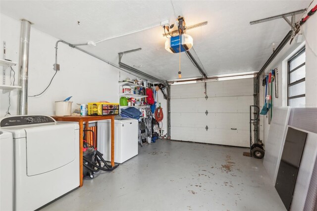 garage with a garage door opener, fridge, and independent washer and dryer