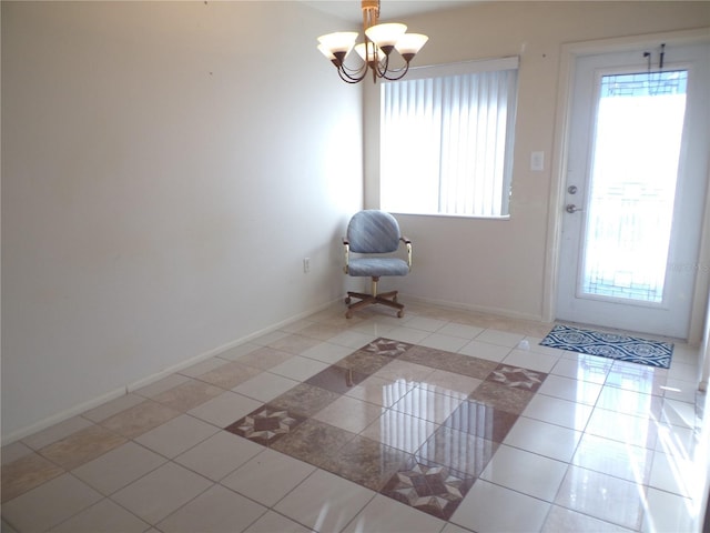 entryway featuring light tile patterned flooring and a chandelier