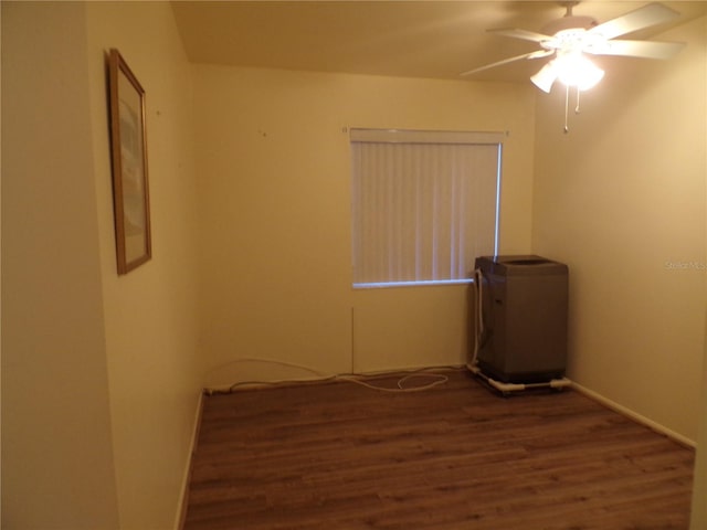 empty room featuring dark hardwood / wood-style floors and ceiling fan