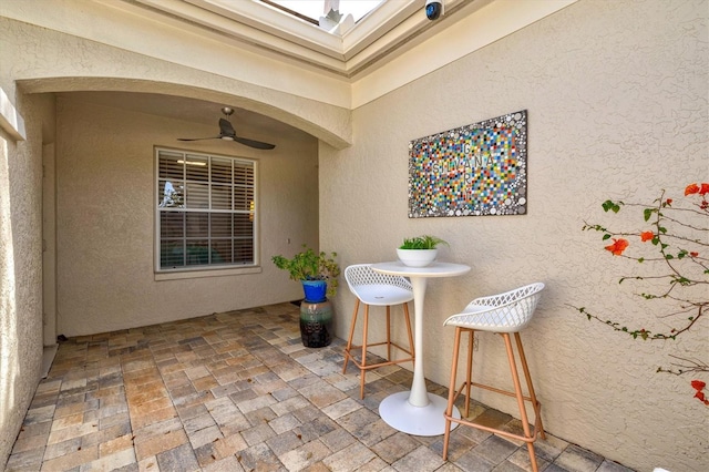 view of patio / terrace featuring ceiling fan