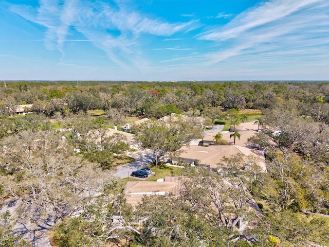 drone / aerial view featuring a view of trees